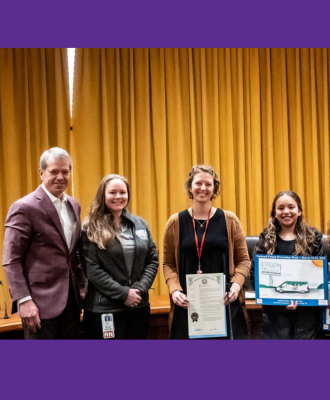  Nebraska governor poses with poster contest winners